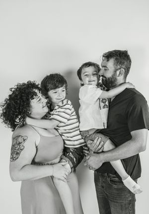 A black and white photo sequence showing a couple sharing tender moments while holding their young child.