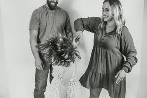 A series of black and white photos showing people posing together in coordinated casual outfits.