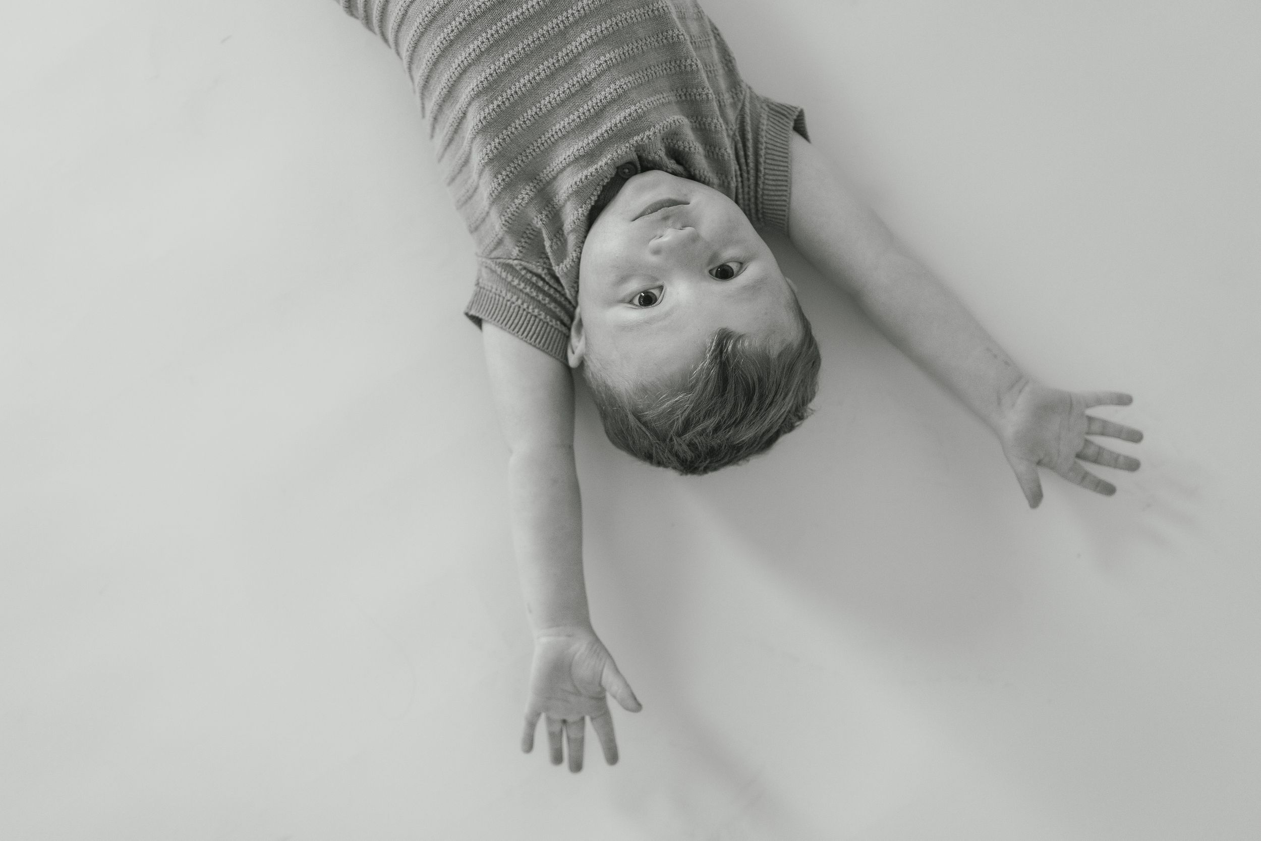 A series of black and white photos showing expressive gestures and poses against a light background.