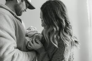 Black and white photo series showing romantic couple embracing and sharing intimate moments together.