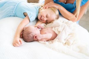 Sweet newborn photography session capturing peaceful sleeping moments.