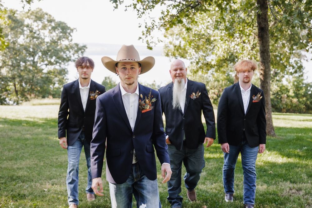 Groom laughing with his groomsmen before a Snohomish ceremony. Authentic lifestyle wedding photos by Tim Neal.