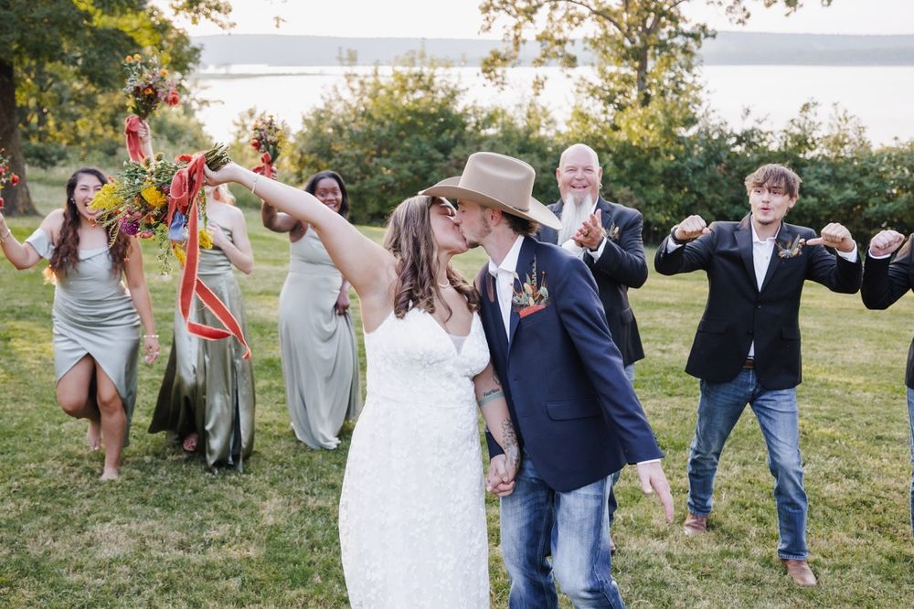 Joyful wedding party cheering for the newlyweds in Snohomish. Candid and fun wedding photography by Tim Neal.