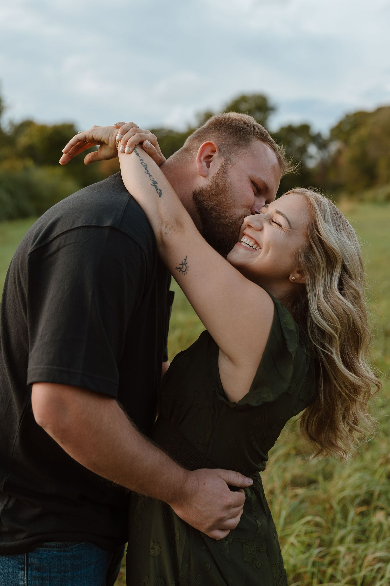 New england couple holding hands and walking for engagement photos at comstock covered bridge