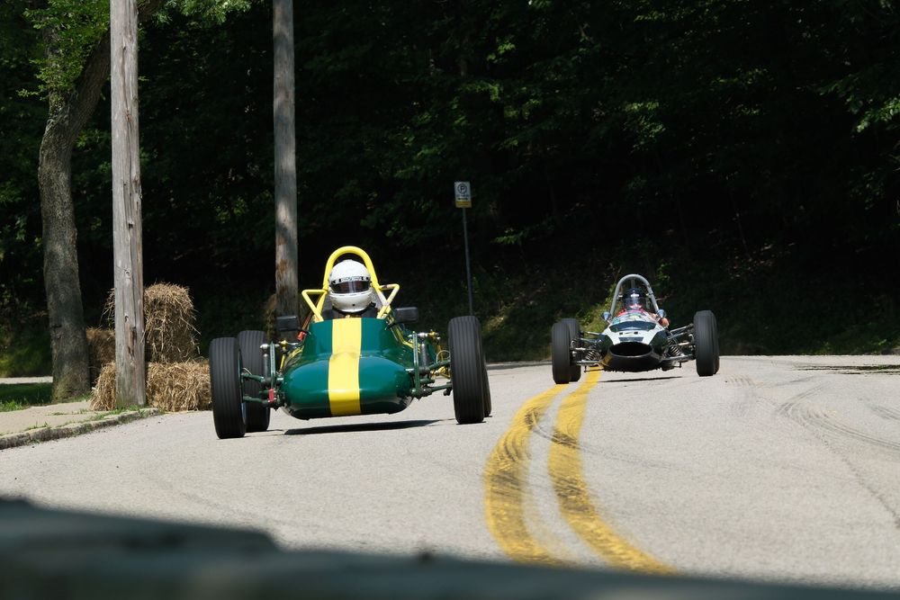 Vintage Formula cars racing in Schenley Park during Pittsburgh Vintage Grand Prix.