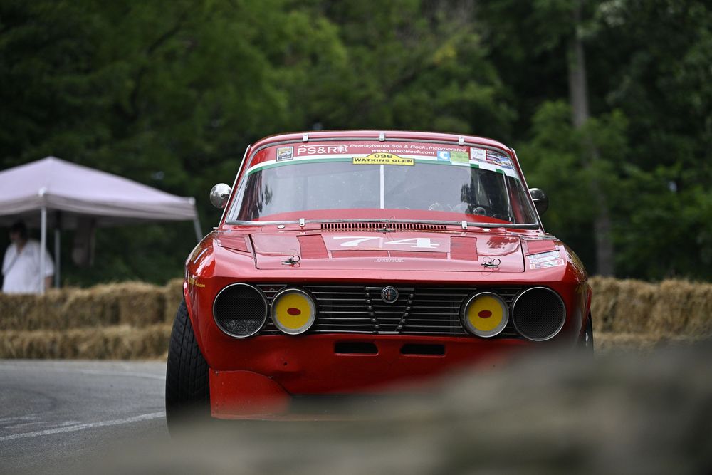 close-up of a classic alfa sports car racing through Schenley park at the Pittsburgh Vintage Grand Prix.