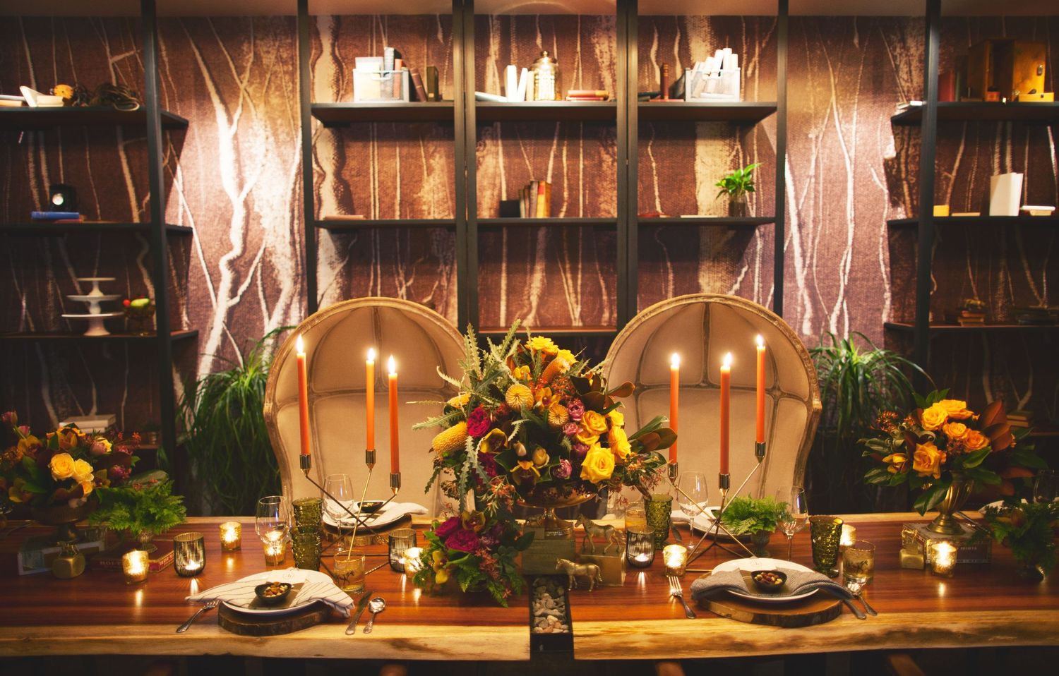 regal table scape on dark wooden table with candles and flowers