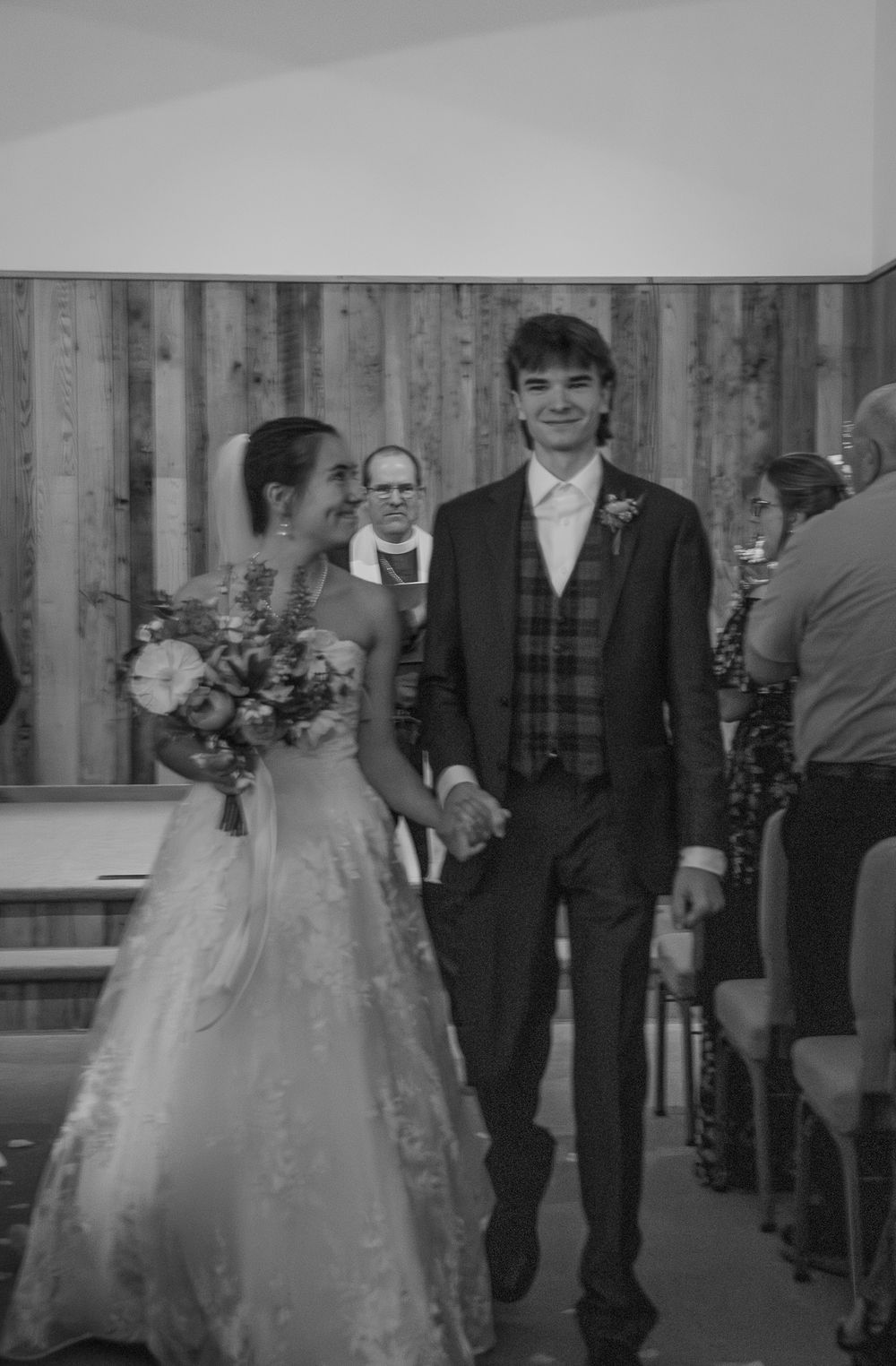 Black and white wedding processional with bride in full gown and attendants. Historic venue wedding photographer North Carolina
