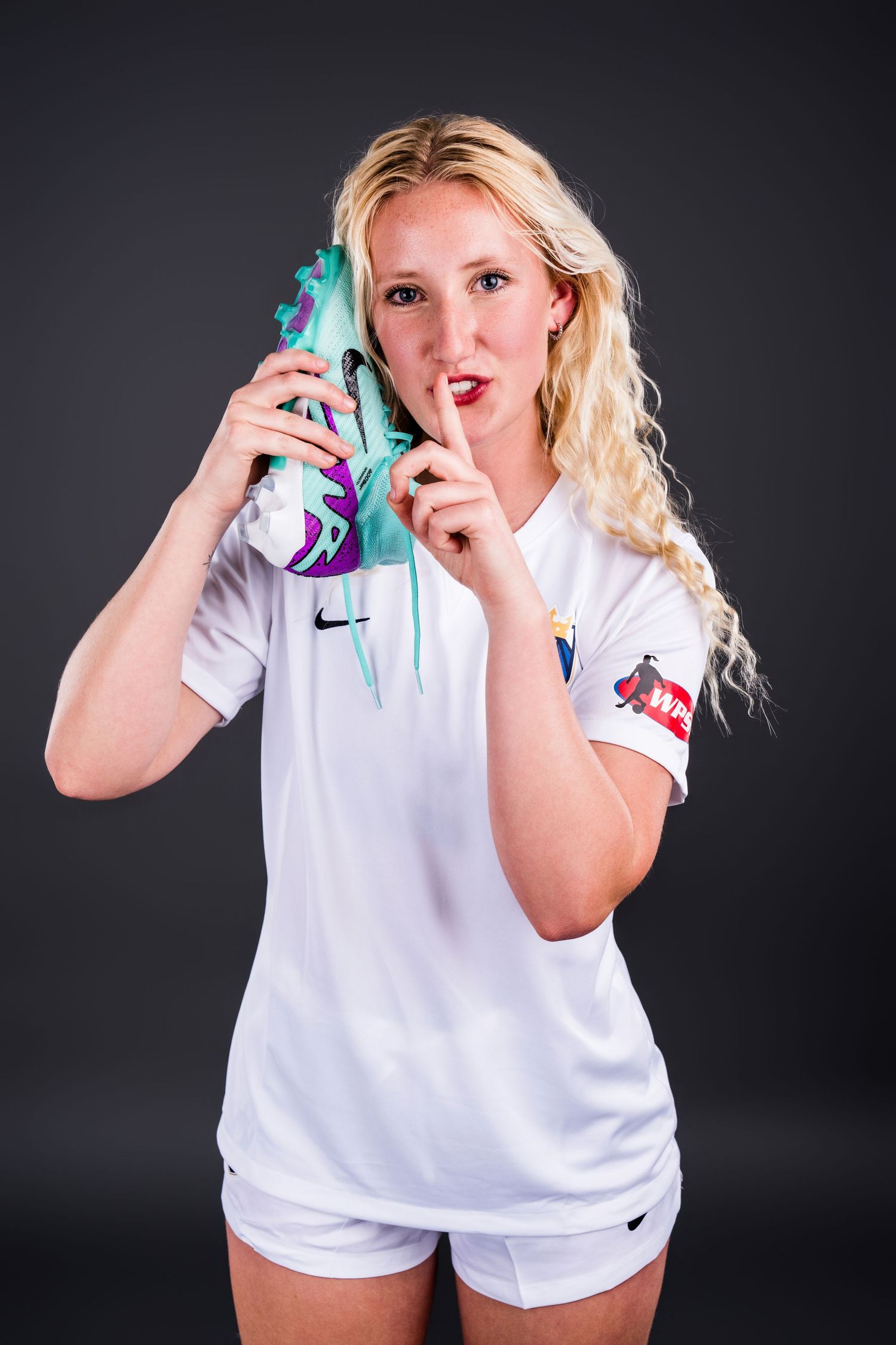 A female soccer player from the Seattle Reign FC II in the Women's Premier Soccer League during their media day.