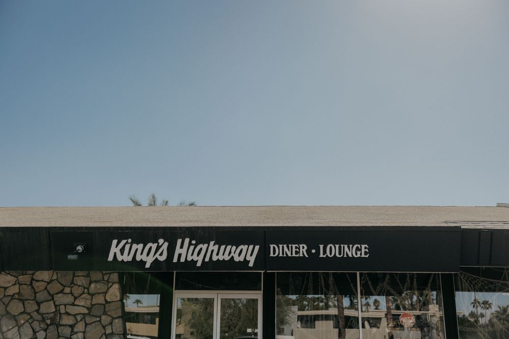 Vintage-style King's Highway diner and lounge storefront signage.