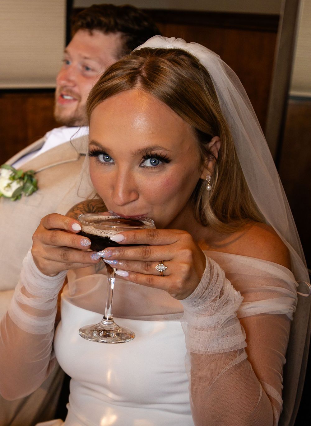 A series of photos showing a bride sipping champagne through a straw while wearing a white wedding dress and veil.