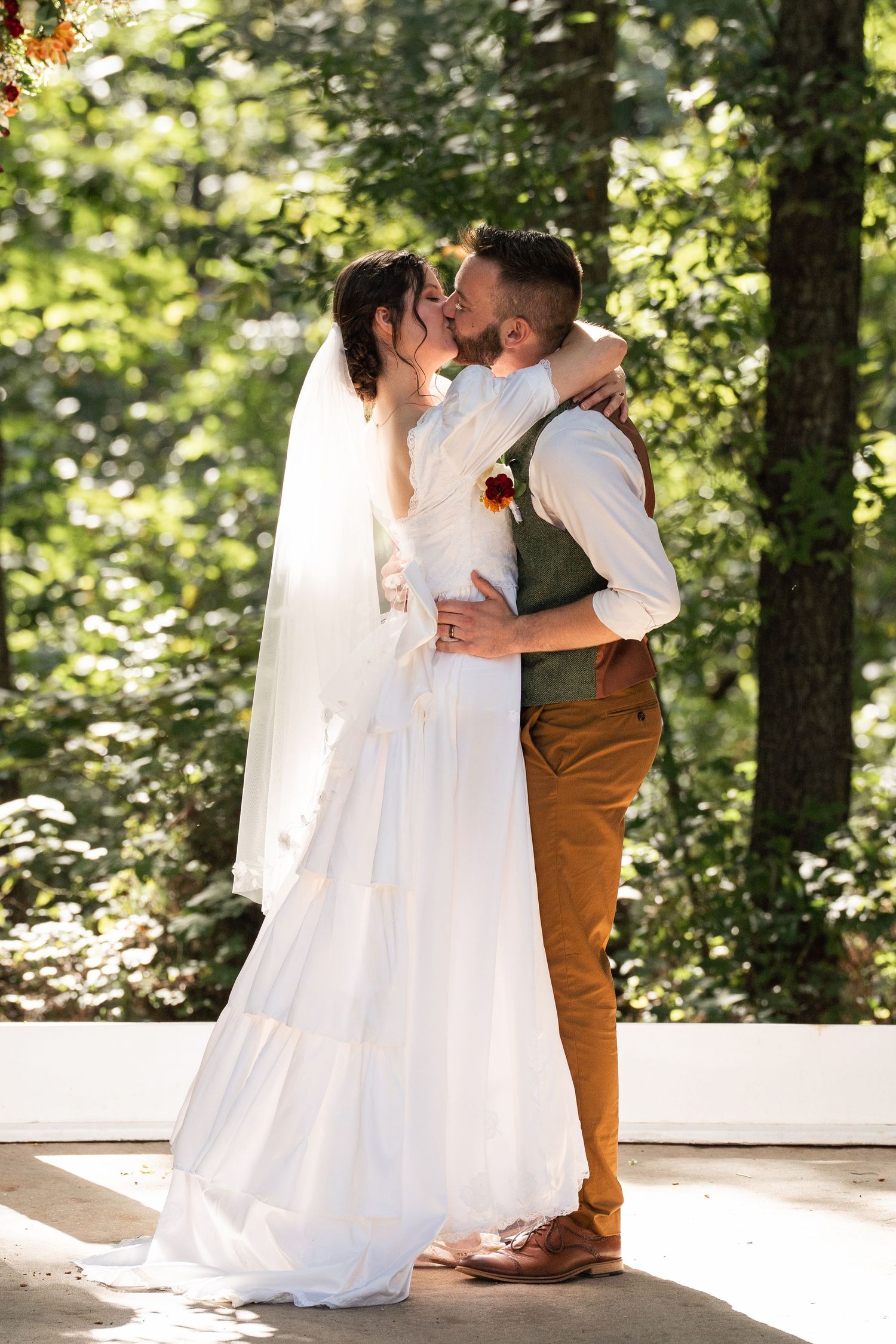 ©AnnaVonRiesenPhotography Wedding Photography | Color image of bride and groom's first kiss at the altar