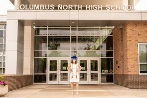 Architectural detail of Columbus North High School's entrance with white columns.