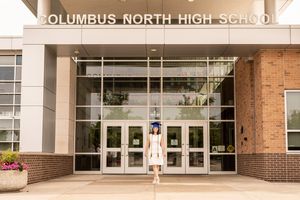 Columbus North High School entrance featuring glass doors and brick exterior.