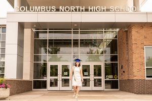 Main entrance signage and walkway of Columbus North High School building.