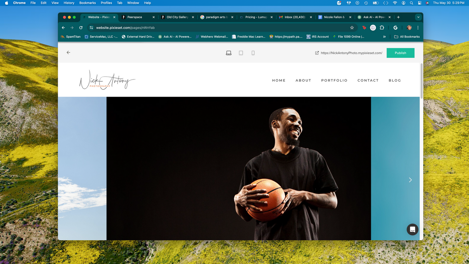 Photographer website homepage showing man holding basketball against dark background.