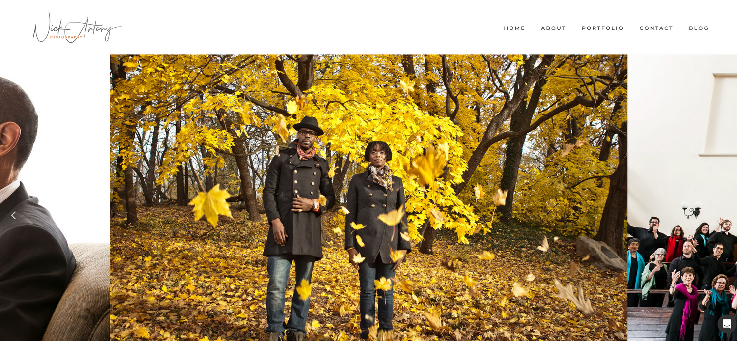 Photography website homepage showing couple tossing autumn leaves in golden fall forest.