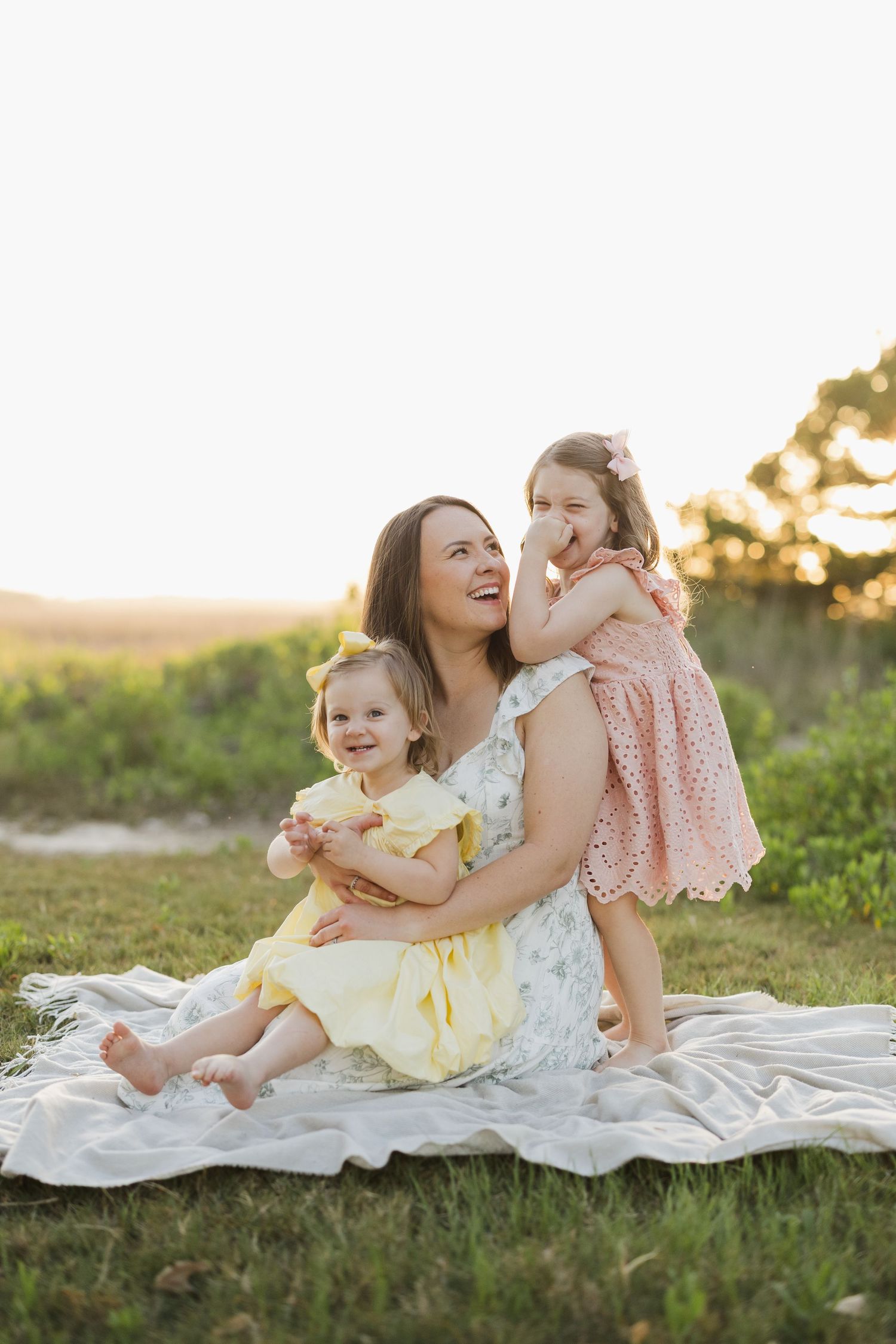 mother holding two daughters