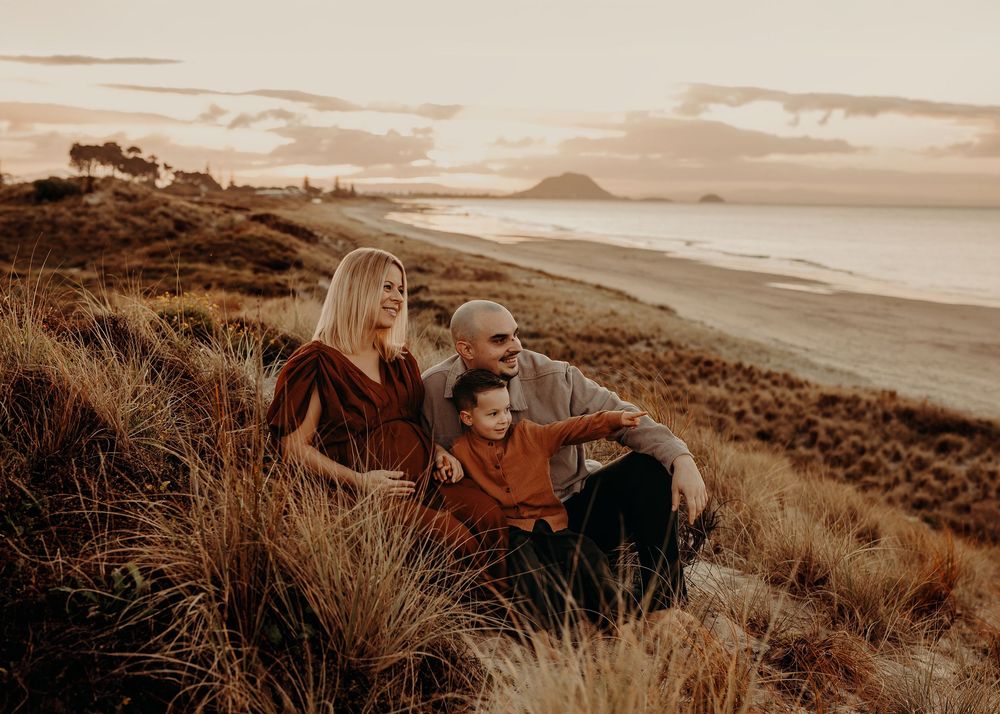 Panoramic series of sunset photos captured in warm sepia tones along rugged coastal hills and grasslands.