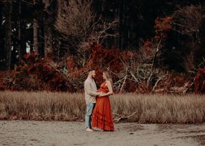 A series of seven connected autumn scenes show a couple in a red dress and beige sweater embracing in a rustic field.
