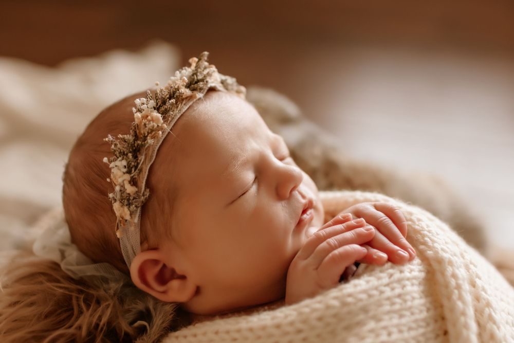 Close up of newborn swaddled during in-home session in Denver NC