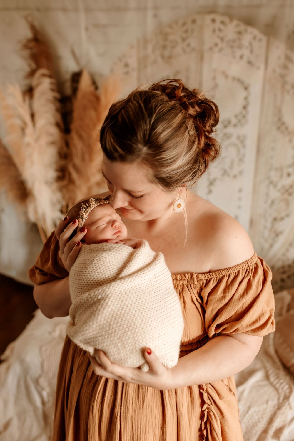 Parents holding newborn during in-home session in Sherrills Ford NC