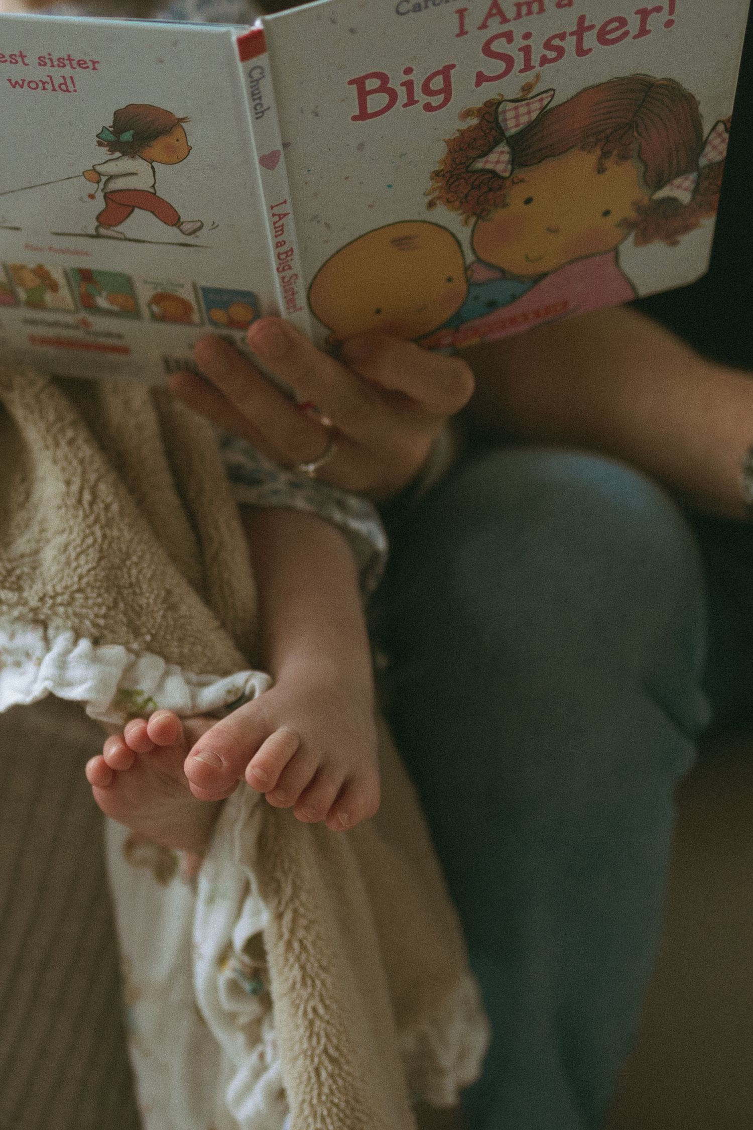 A collection of children's books and small hands shown in a series of connected images.