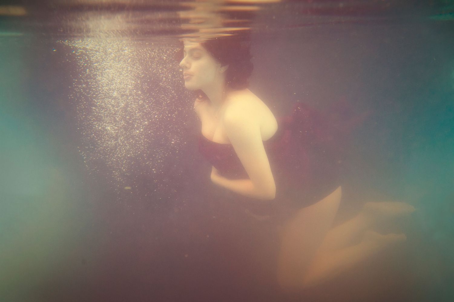 Ethereal underwater scene with bubbles and light creating a dreamy aquatic atmosphere.