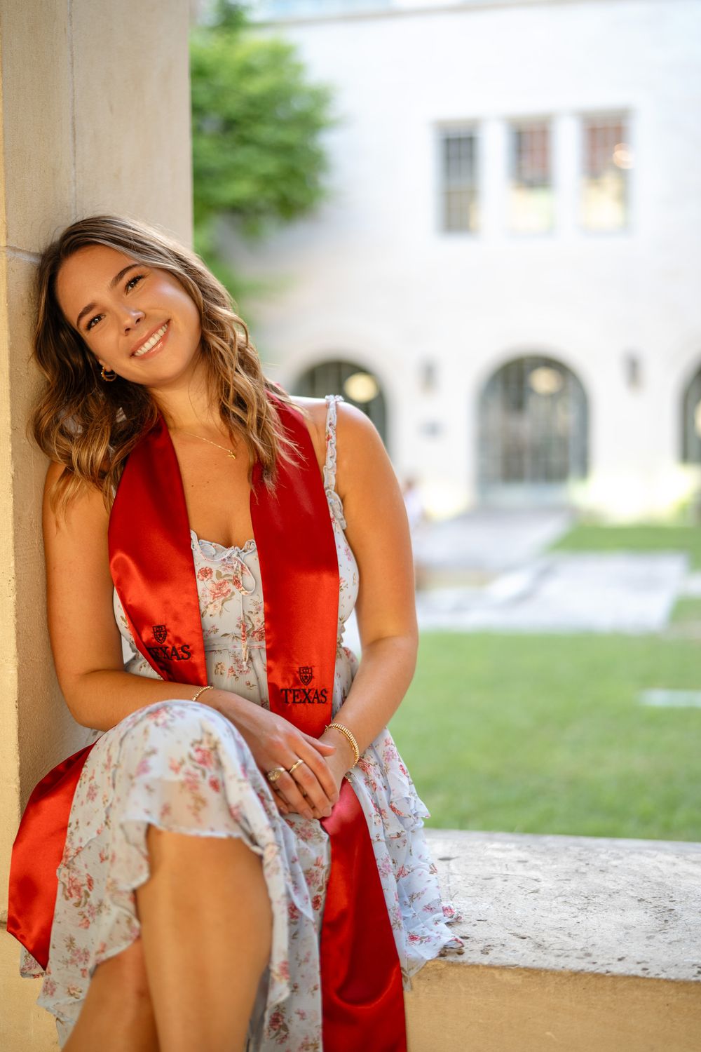 Outdoor portrait session under covered walkway with natural lighting.