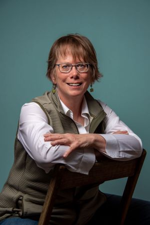 Business woman, siting in chair, portrait.