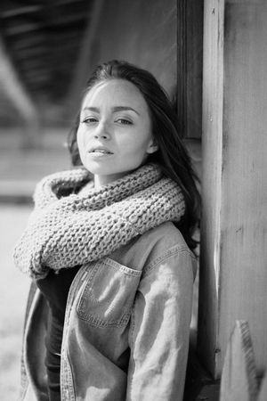Winter portrait featuring chunky knit scarf and denim jacket in black and white.