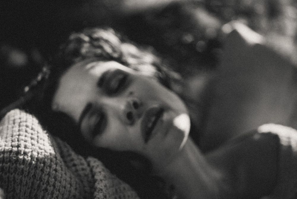 Intimate black and white close-up sequence with soft focus.