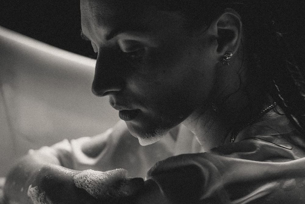 Dramatic black and white close-up sequence capturing intimate expressions.