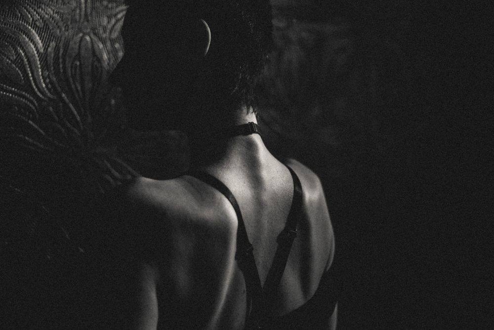 Dark atmospheric portrait sequence with dramatic lighting and shadows.