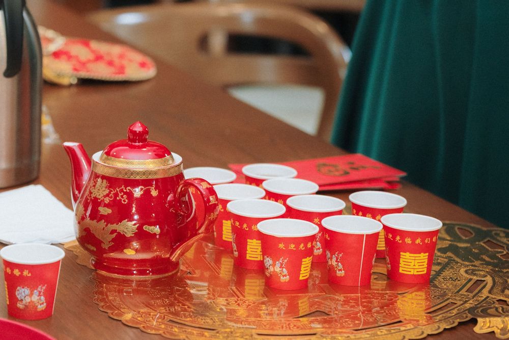Cultural tea ceremony in traditional attire during Tiffany and Sam’s Toronto wedding.