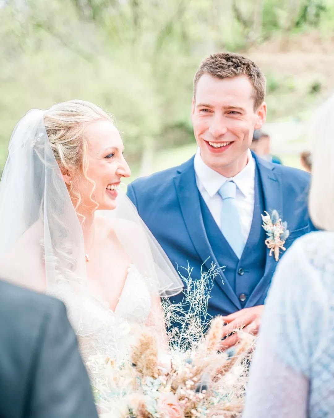 Traditional English Heritage Wedding at Wollaton Hall Nottingham – Bride in White Wedding Gown and Groom in Blue Tuxedo Suit Stood at alter.
