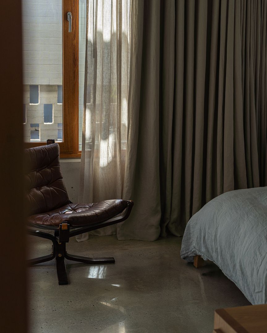 Interior design photograph of a luxurious high-end master primary bedroom with furniture detail in Perth