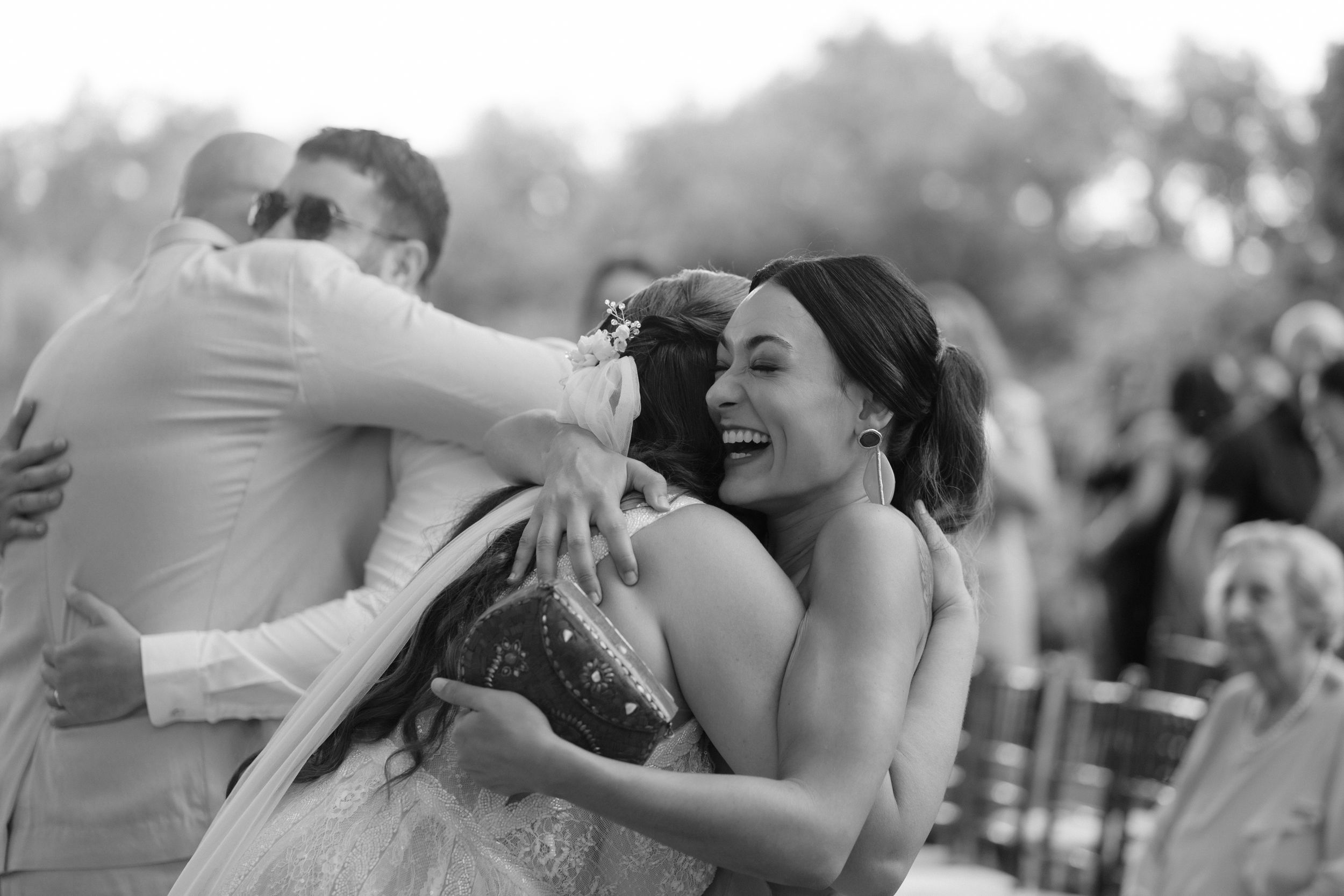 Candid wedding moments captured in a series of emotional black and white photographs.