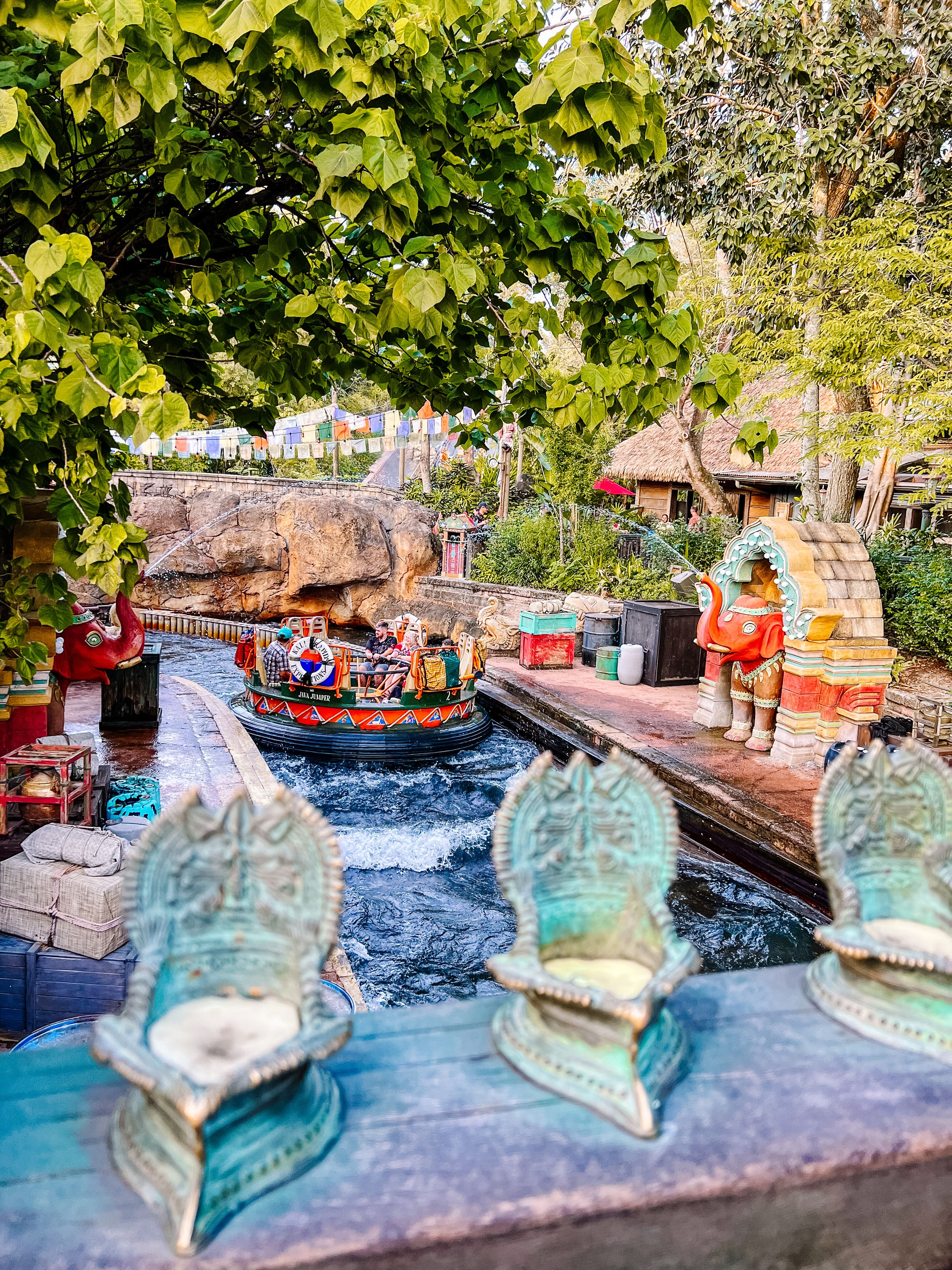 Splash Mountain water ride at Disney theme park with turquoise decorative boots visible in the foreground.