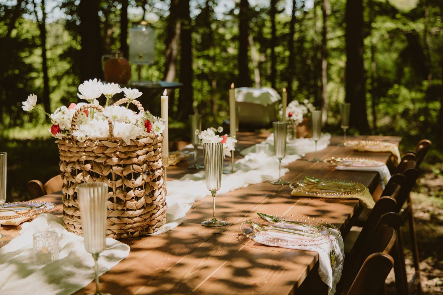 Delicate white flowers bloom against a dark moody background in a wedding setting.