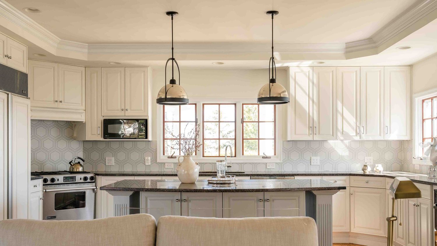 bright and airy kitchen with chrome pendants