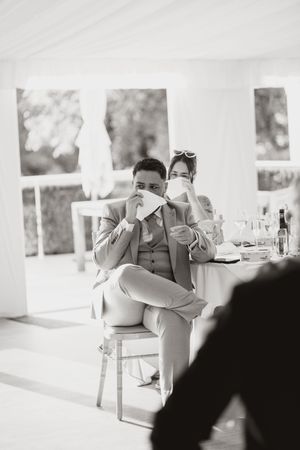 A sequence of black and white photos showing guests drinking from cups at a formal event.