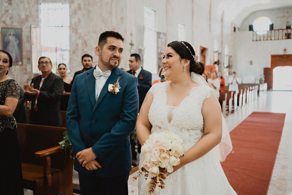 Romantic gaze shared by the couple at the altar, both smiling as they celebrate their love