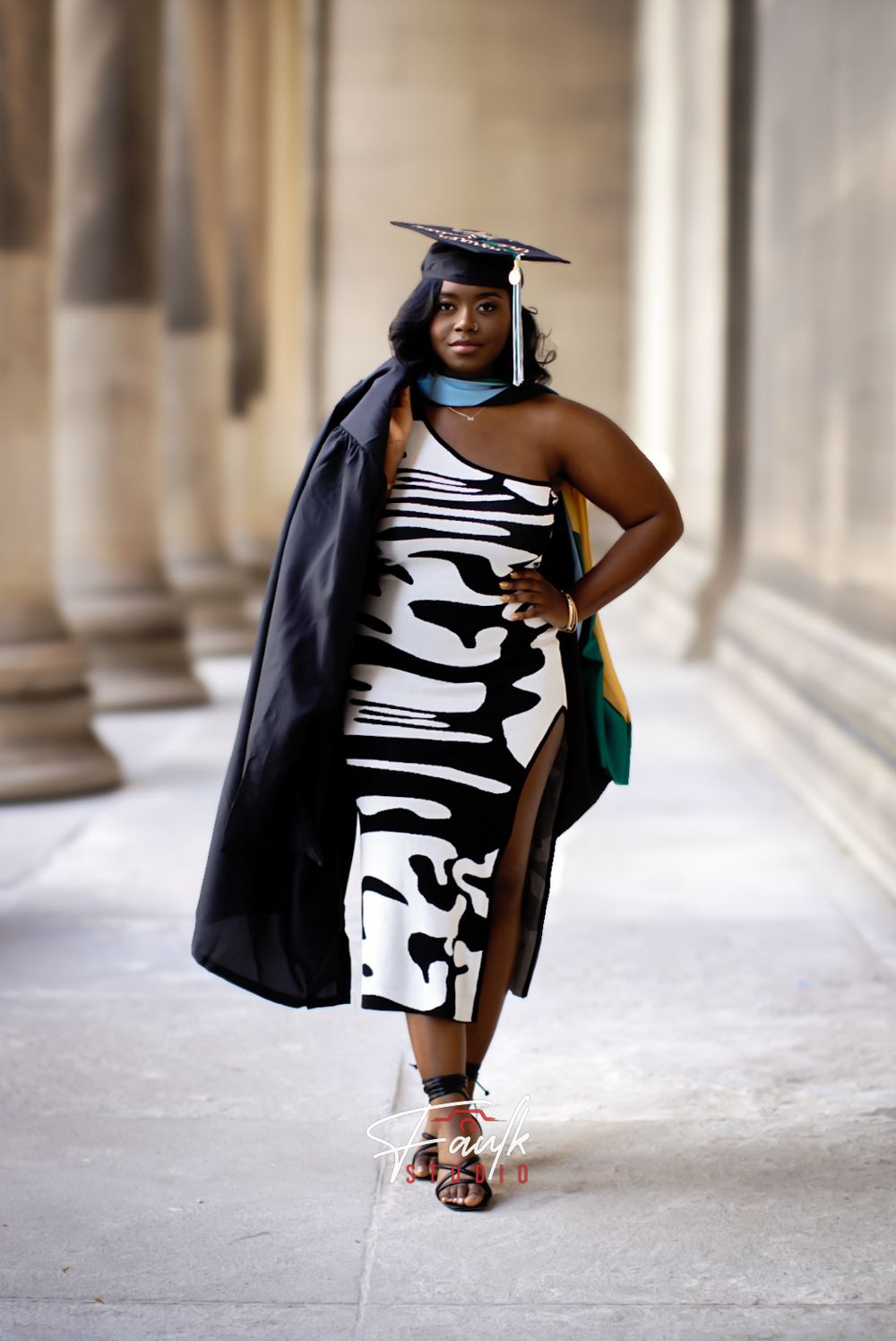 A series of fashion photos showing a black and white graphic dress styled with a black blazer and metallic sandals.