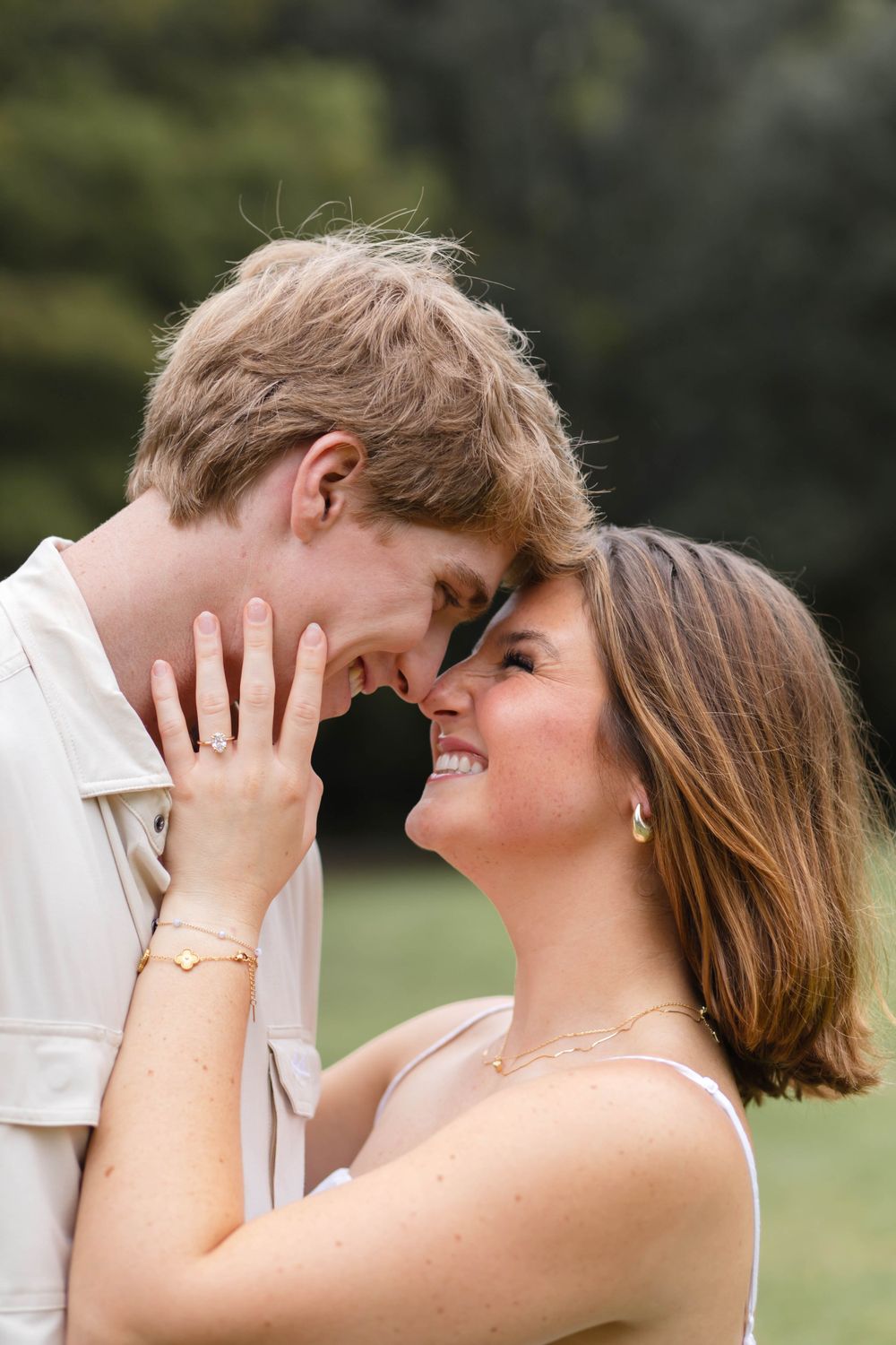 Intimate close-up of couple sharing romantic moment outdoors.