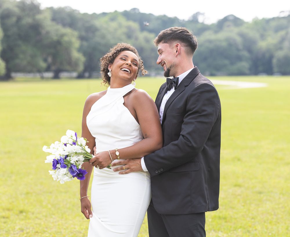 bride and groom, mixed race couple, wedding photographer, bridal bouquet, black bride, hispanic groom, wedding decor, wedding gown, laughing