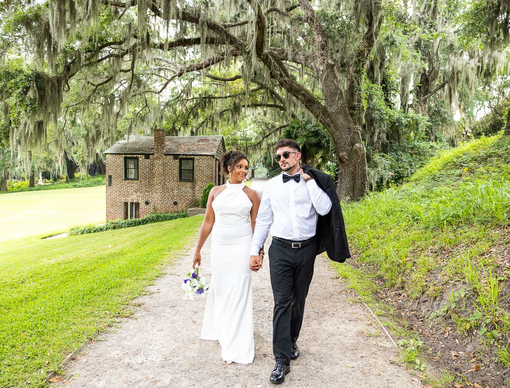 bride and groom, mixed race couple, wedding photographer, bridal bouquet, black bride, hispanic groom, wedding decor, wedding gown, walking