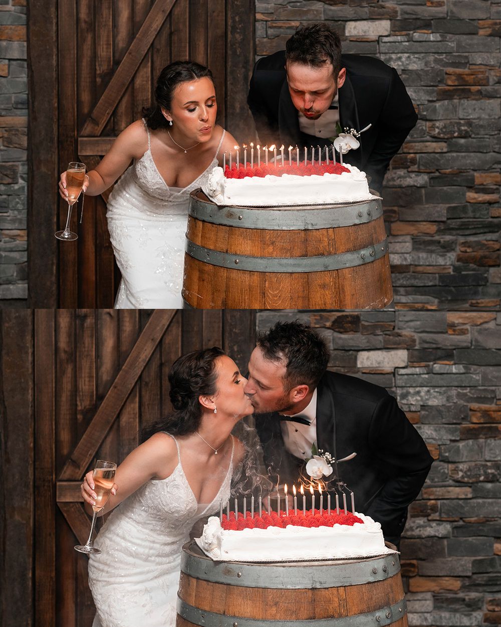 Bride and groom blowing out candles on wedding cake, kissing after, in rustic barn venue with stone wall backdrop.