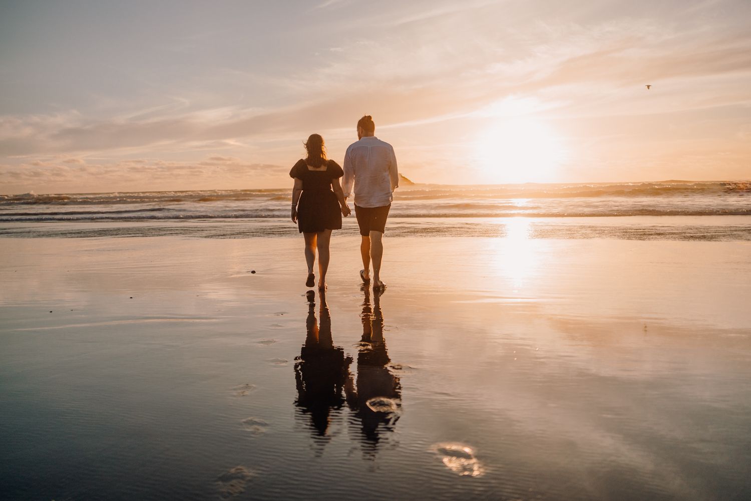 Couple having a moment in the beach. Photo by Apertured Media- Auckland Wedding Photographer