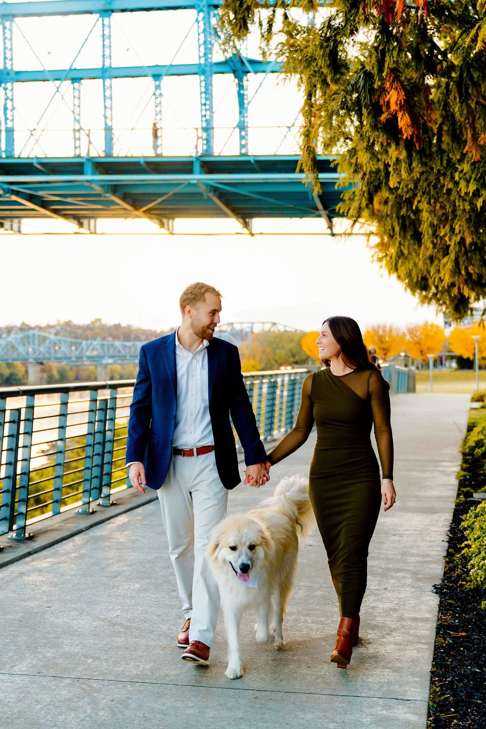 Liz and Chris's Engagement Downtown Cincinnati at Smale Park with walking with their puppy by the Roebling: Cincinnati Wedding Photographer